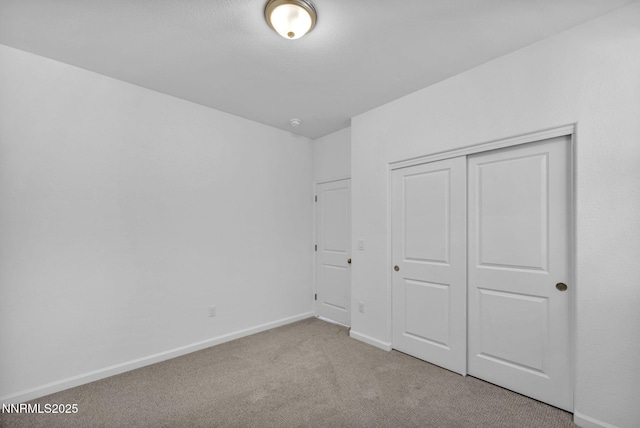 6776 Shell Ct Lot 51, Fernley, NV 89408 - unfurnished bedroom with carpet floors, baseboards, and a closet