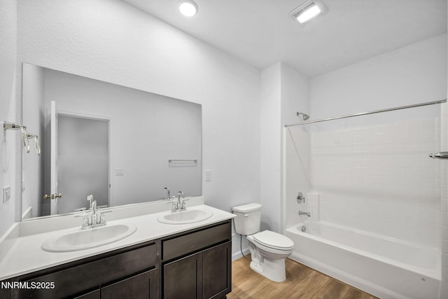 6776 Shell Ct Lot 51, Fernley, NV 89408 - bathroom with wood finished floors, toilet, double vanity, and shower / washtub combination