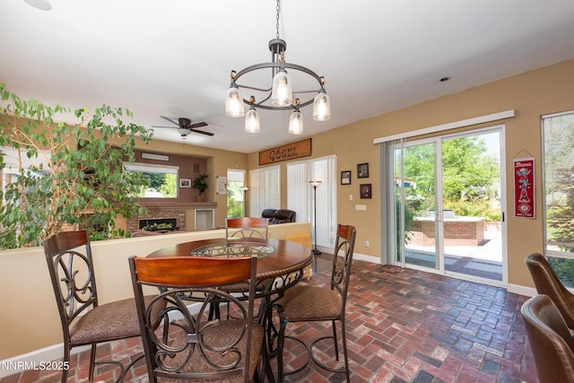 2080 St George Way, Carson City, NV 89703 - dining room with baseboards, a chandelier, brick floors, and ceiling fan