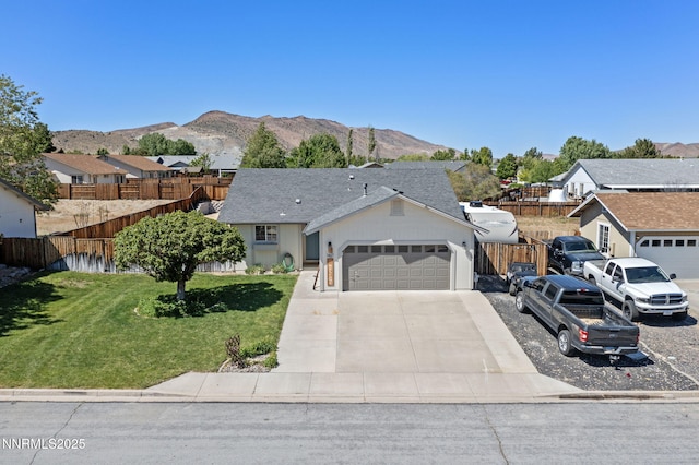 1427 Rosy Finch Dr, Spanish Springs, NV 89441 - ranch-style house featuring an attached garage, a residential view, concrete driveway, and a mountain view