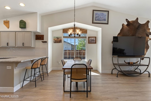 1427 Rosy Finch Dr, Spanish Springs, NV 89441 - dining area with lofted ceiling, a chandelier, light wood-style flooring, recessed lighting, and baseboards