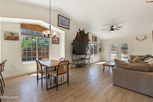 1427 Rosy Finch Dr, Spanish Springs, NV 89441 - dining space featuring lofted ceiling, a chandelier, light wood finished floors, ceiling fan, and baseboards