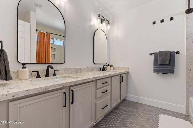 1427 Rosy Finch Dr, Spanish Springs, NV 89441 - bathroom featuring double vanity, baseboards, tile patterned floors, and curtained shower