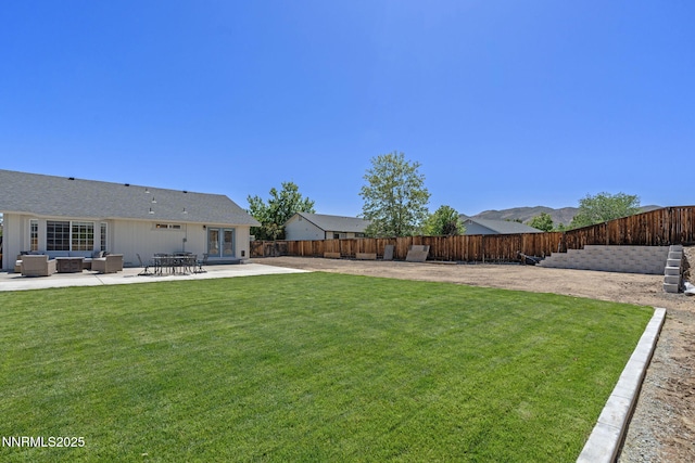 1427 Rosy Finch Dr, Spanish Springs, NV 89441 - view of yard featuring outdoor lounge area, french doors, and a patio