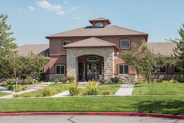 6850 Sharlands Ave Unit Ac2179, Reno, NV 89523 - view of front facade with stone siding, stucco siding, a front yard, and a tiled roof