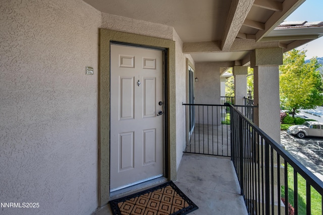 6850 Sharlands Ave Unit Ac2179, Reno, NV 89523 - property entrance with stucco siding and a balcony