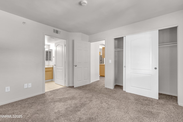 6850 Sharlands Ave Unit Ac2179, Reno, NV 89523 - unfurnished bedroom featuring light colored carpet, a closet, baseboards, arched walkways, and connected bathroom