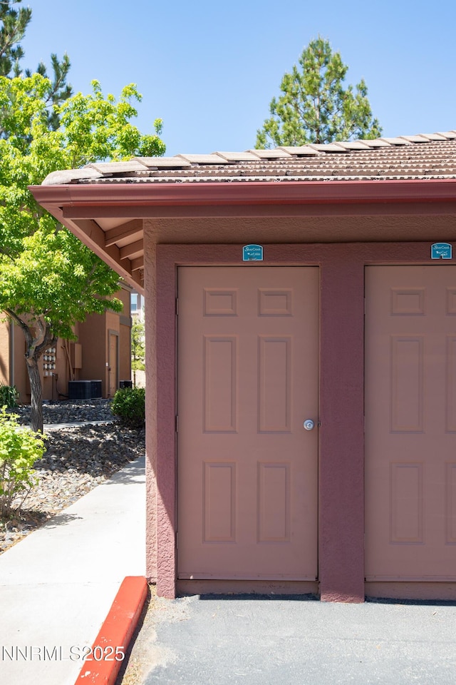 6850 Sharlands Ave Unit Ac2179, Reno, NV 89523 - property entrance featuring roof mounted solar panels, stucco siding, and central AC