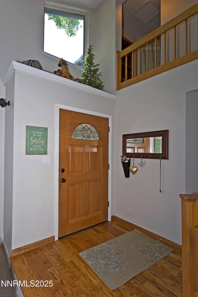 4115 Willowsprings Ct, Reno, NV 89519 - entryway featuring a high ceiling, baseboards, and wood finished floors