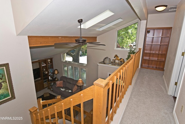 4115 Willowsprings Ct, Reno, NV 89519 - corridor featuring lofted ceiling, carpet, a skylight, and baseboards