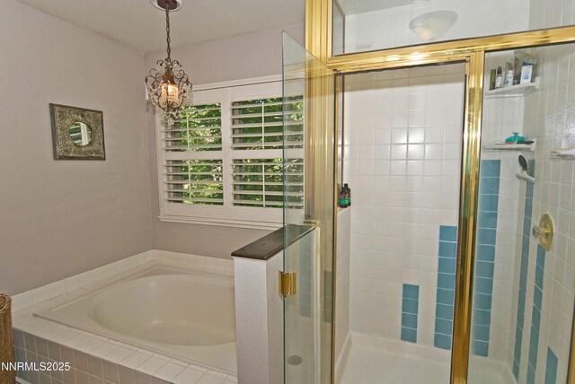 4115 Willowsprings Ct, Reno, NV 89519 - full bathroom with a garden tub, a stall shower, and a chandelier