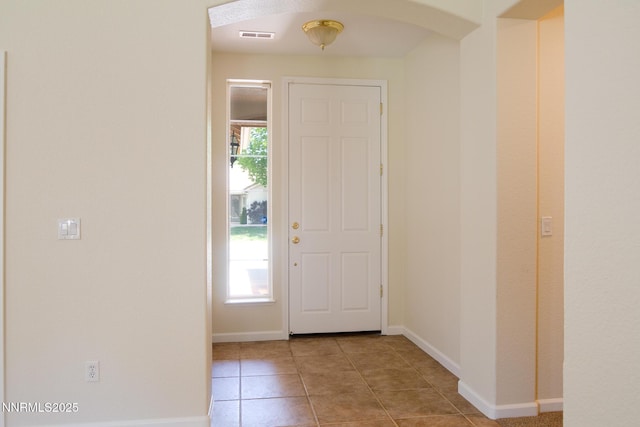 637 Donner Pass Ct, Sparks, NV 89436 - foyer with arched walkways, tile patterned floors, and baseboards