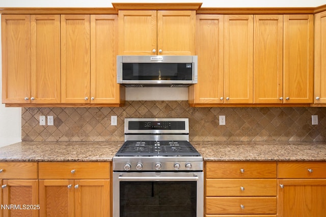 637 Donner Pass Ct, Sparks, NV 89436 - kitchen with stainless steel appliances, tasteful backsplash, and light stone counters
