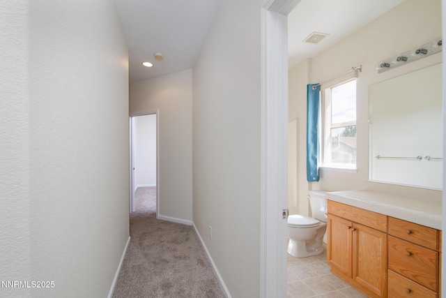 637 Donner Pass Ct, Sparks, NV 89436 - bathroom with toilet, vanity, baseboards, and recessed lighting