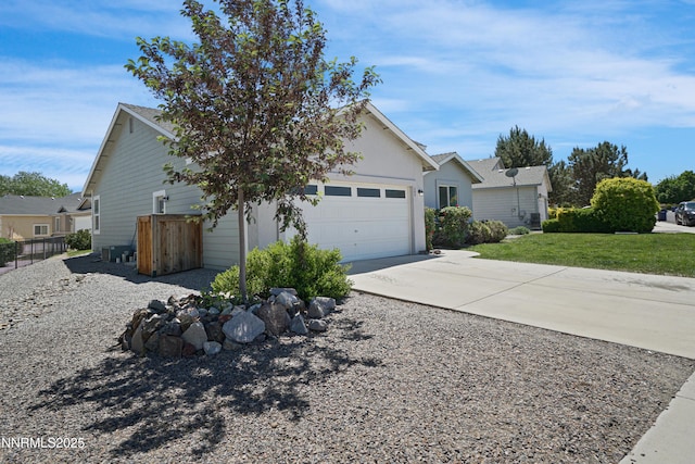 342 Bens Way, Fernley, NV 89408 - view of property exterior featuring driveway, a garage, and central AC
