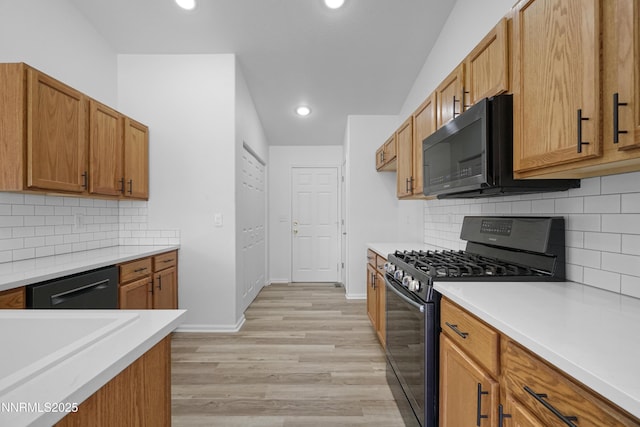 342 Bens Way, Fernley, NV 89408 - kitchen with black appliances, light countertops, light wood finished floors, backsplash, and recessed lighting