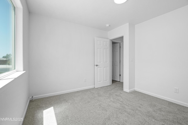 342 Bens Way, Fernley, NV 89408 - empty room with carpet flooring, baseboards, and a smoke detector