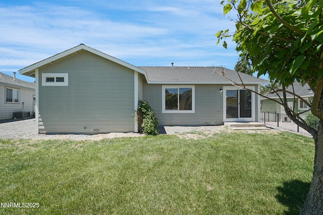 342 Bens Way, Fernley, NV 89408 - rear view of house with a yard, central air condition unit, and roof with shingles