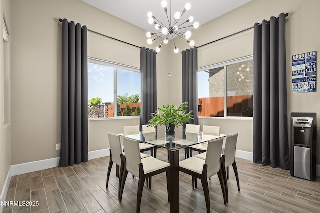 9425 Stony Hill Rd, Reno, NV 89521 - dining area with a chandelier, wood finished floors, and baseboards