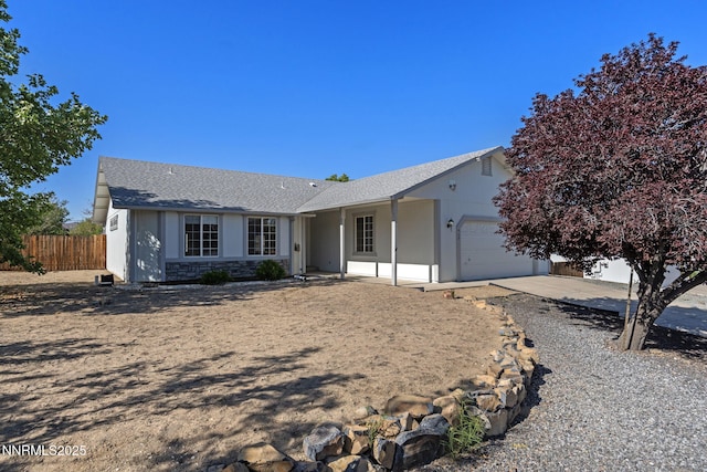 439 Beau Ct, Sparks, NV 89436 - ranch-style home with a garage, driveway, and stone siding