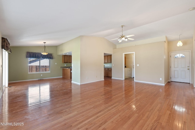 439 Beau Ct, Sparks, NV 89436 - unfurnished living room featuring light wood-type flooring, a ceiling fan, baseboards, and lofted ceiling
