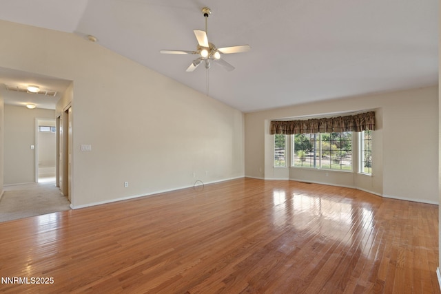 439 Beau Ct, Sparks, NV 89436 - unfurnished room featuring vaulted ceiling, ceiling fan, light wood-style floors, and baseboards