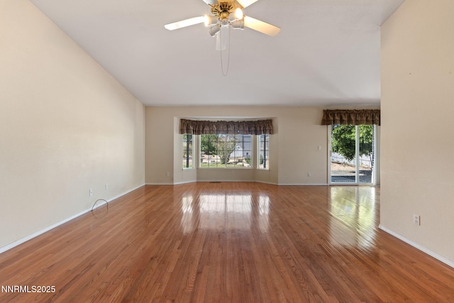 439 Beau Ct, Sparks, NV 89436 - spare room featuring healthy amount of natural light, wood finished floors, a ceiling fan, baseboards, and lofted ceiling