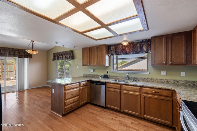 439 Beau Ct, Sparks, NV 89436 - kitchen featuring stainless steel dishwasher, a peninsula, a sink, plenty of natural light, and lofted ceiling