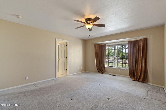 439 Beau Ct, Sparks, NV 89436 - spare room featuring a ceiling fan, baseboards, carpet flooring, and a smoke detector