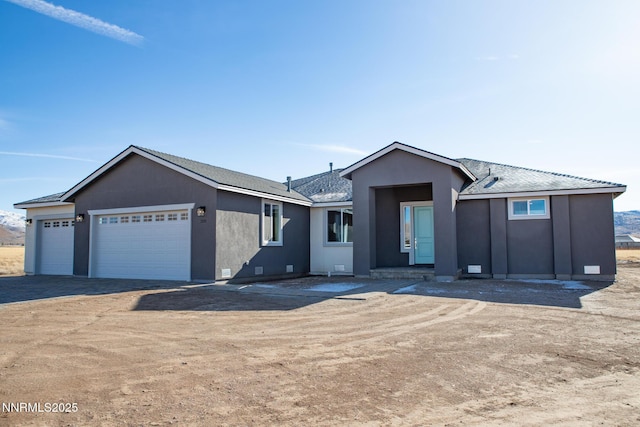 255 Pinto Ranch Ct, Reno, NV 89510 - ranch-style home featuring an attached garage, stucco siding, and driveway