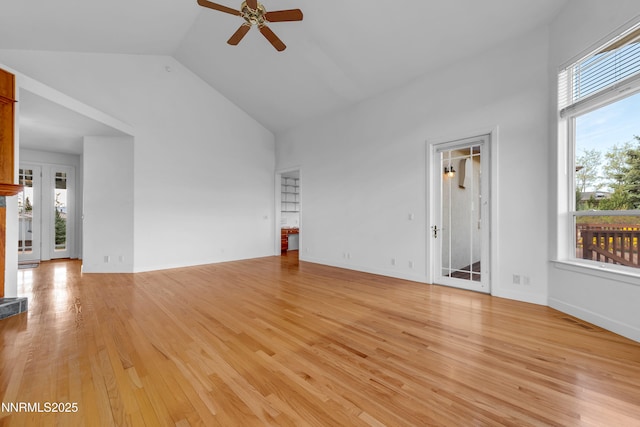 615 Oxbow Ct, Reno, NV 89511 - unfurnished living room with ceiling fan, high vaulted ceiling, and light wood-style flooring