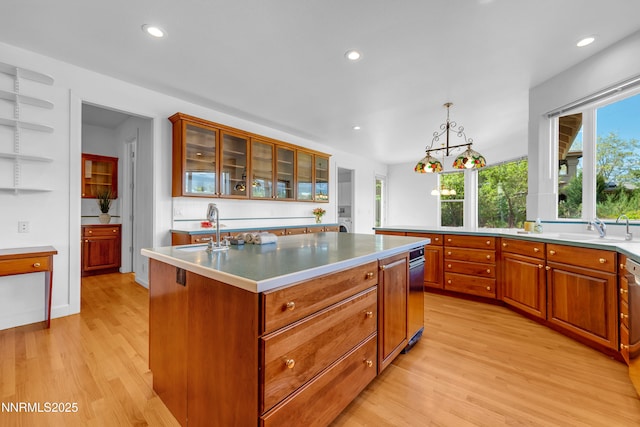 615 Oxbow Ct, Reno, NV 89511 - kitchen featuring a sink, light wood-type flooring, a center island, recessed lighting, and brown cabinets
