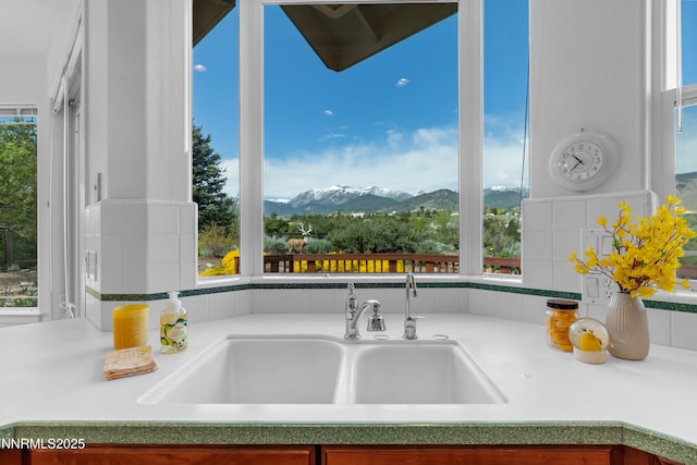 615 Oxbow Ct, Reno, NV 89511 - kitchen view of mountains, a sink, and light countertops