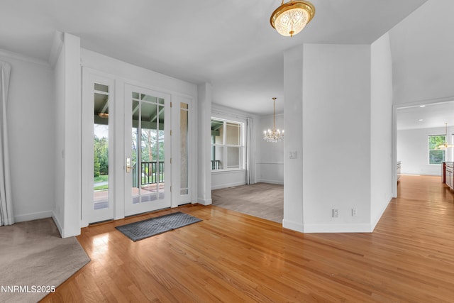 615 Oxbow Ct, Reno, NV 89511 - foyer featuring a chandelier, wood finished floors, and baseboards