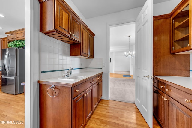 615 Oxbow Ct, Reno, NV 89511 - kitchen featuring stainless steel refrigerator with ice dispenser, light wood-style flooring, light countertops, and recessed lighting