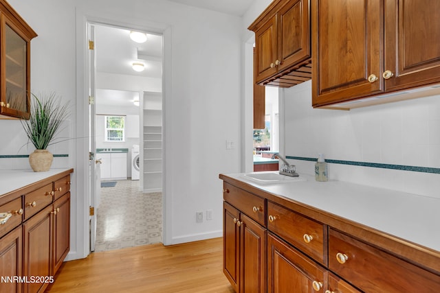 615 Oxbow Ct, Reno, NV 89511 - bathroom with vanity, washer / clothes dryer, and baseboards