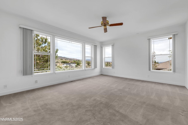 615 Oxbow Ct, Reno, NV 89511 - empty room with plenty of natural light, ceiling fan, and carpet