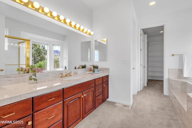 615 Oxbow Ct, Reno, NV 89511 - bathroom with vanity, a tub, baseboards, a shower, and a spacious closet