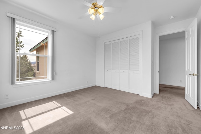 615 Oxbow Ct, Reno, NV 89511 - unfurnished bedroom featuring carpet flooring, multiple windows, a closet, and baseboards