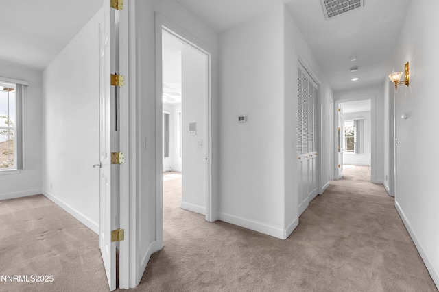 615 Oxbow Ct, Reno, NV 89511 - hall featuring light carpet, plenty of natural light, and baseboards