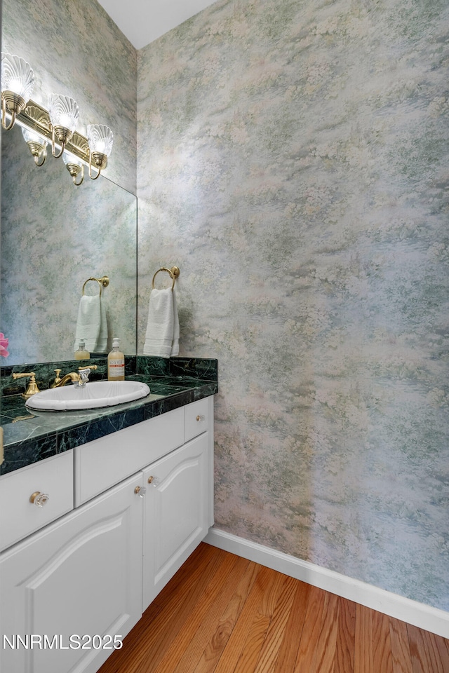 615 Oxbow Ct, Reno, NV 89511 - bathroom with wood finished floors, vanity, baseboards, and a chandelier
