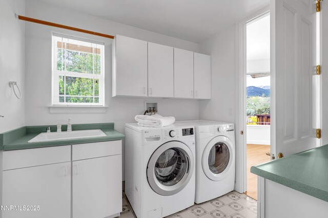 615 Oxbow Ct, Reno, NV 89511 - washroom featuring washing machine and clothes dryer, healthy amount of natural light, cabinet space, and light floors