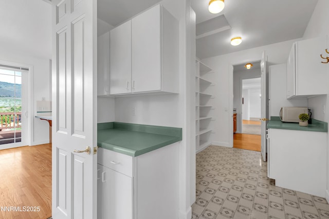 615 Oxbow Ct, Reno, NV 89511 - kitchen featuring white cabinets, open shelves, and baseboards