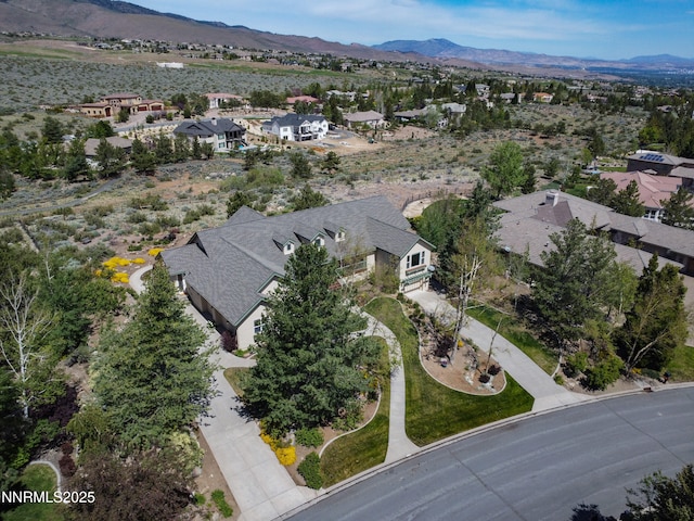 615 Oxbow Ct, Reno, NV 89511 - aerial overview of property's location featuring nearby suburban area and a mountain backdrop