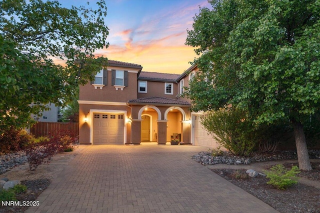 400 Sondrio Ct, Reno, NV 89521 - mediterranean / spanish-style home featuring a tiled roof, decorative driveway, and stucco siding