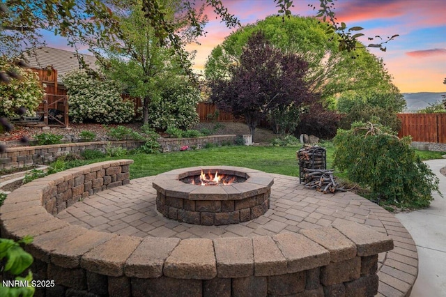 400 Sondrio Ct, Reno, NV 89521 - patio terrace at dusk featuring a fire pit and a patio