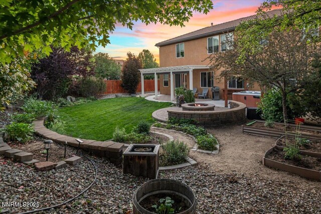 400 Sondrio Ct, Reno, NV 89521 - rear view of property with a fire pit, a patio, a vegetable garden, stucco siding, and a pergola