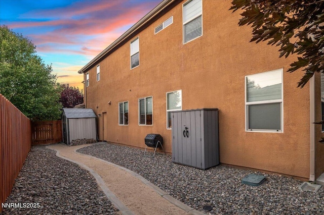 400 Sondrio Ct, Reno, NV 89521 - property exterior at dusk with a fenced backyard and stucco siding