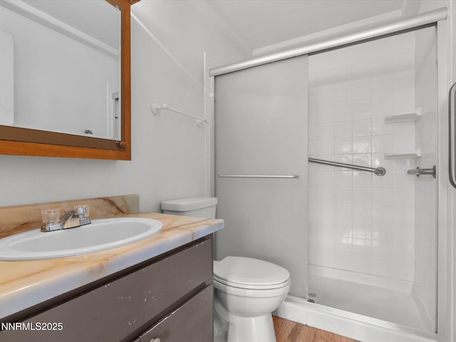 1344 Patricia Dr, Gardnerville, NV 89460 - bathroom featuring a shower stall, vanity, toilet, and wood finished floors