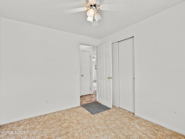 1344 Patricia Dr, Gardnerville, NV 89460 - unfurnished bedroom featuring carpet flooring, a textured ceiling, a closet, baseboards, and ceiling fan